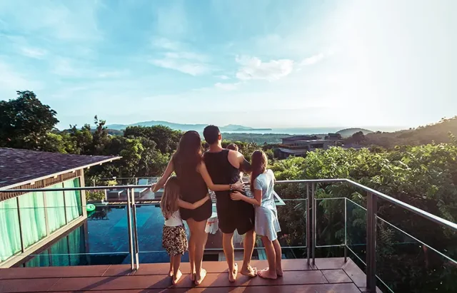 family-terrace-by-sea-watching-sunset-back-view-phuket-thailand copy Family in the terrace by the sea, watching the sunset.