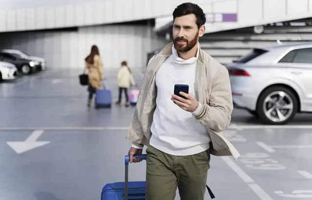 medium-shot-man-holding-phone copy