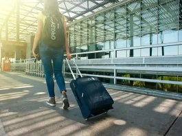 A woman carrying luggage