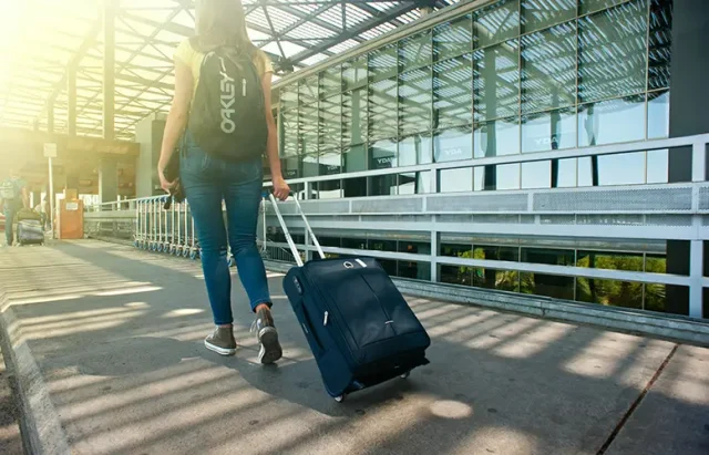 A woman carrying luggage