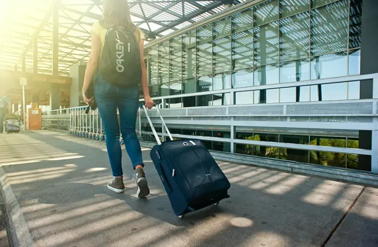 A woman carrying luggage