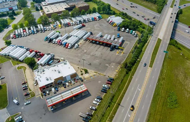 resting-place-truck-stop-various-types-trucks-parking-lot-off-highway-with-gas-station-refueling-car-usa copy