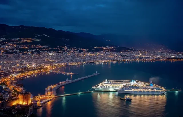 spectacular-night-sea-coast-with-city-cruise-ship-lights-reflected-water copy