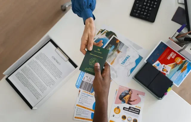 top-view-hands-holding-travel-visa copy