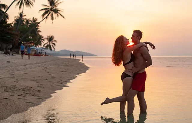 young-sexy-romantic-couple-love-sunset-happy-summer-beach-together-having-fun-wearing-swim-suits copy
