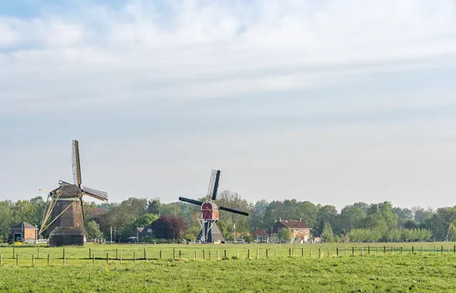 beautiful-view-windmills-field-with-cloudy-blue-sky-background copy
