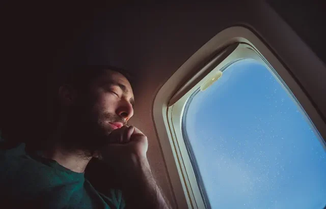 portrait-young-man-looking-through-window copy