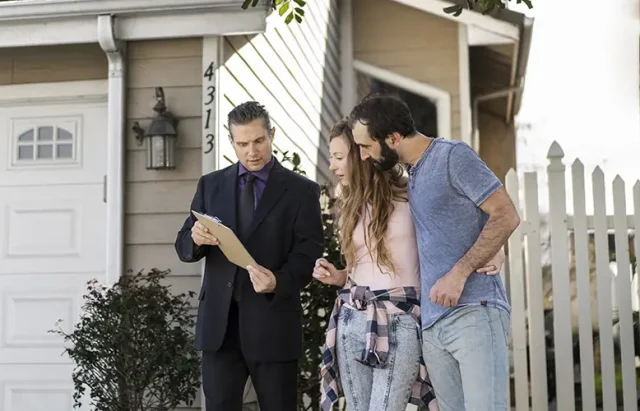 couple-signing-papers-fr-new-house copy
