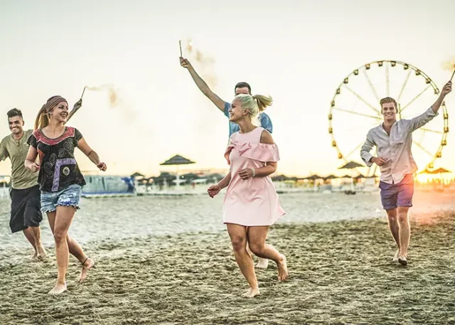 group-of-happy-friends-running-on-the-beach-with-f-2025-10-14-07-53-23-utc copy