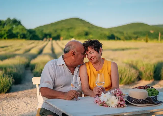 portrait-smiling-friends-sitting-field copy