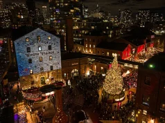 Christmas Tree Lights Up The 2025 Distillery Winter Village