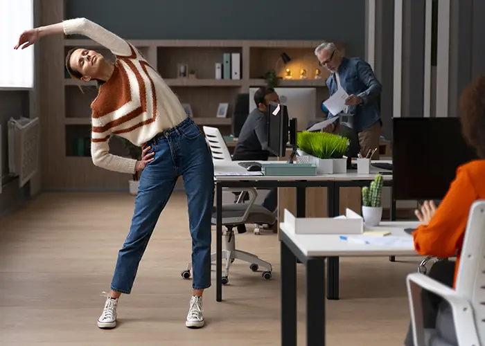 woman-office-stretching-work-day copy