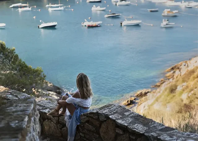 full-shot-woman-looking-boats copy