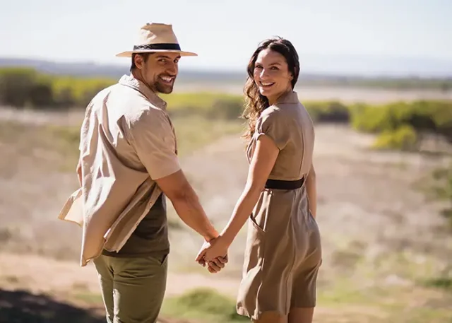 portrait-smiling-couple-holding-hands copy