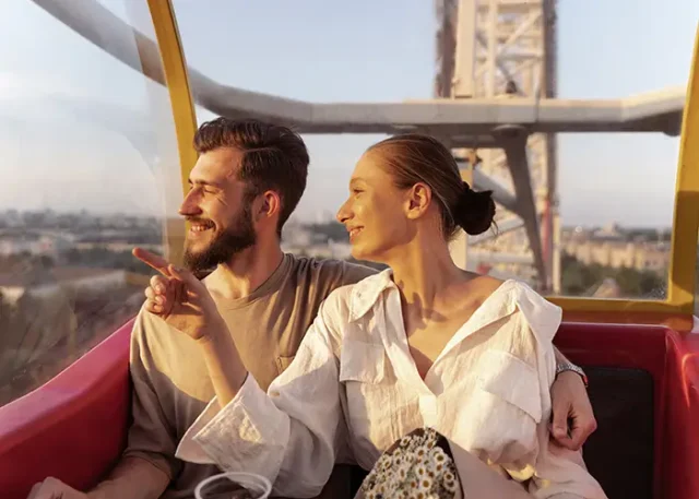 romantic-couple-out-together-ferris-wheel-park copy