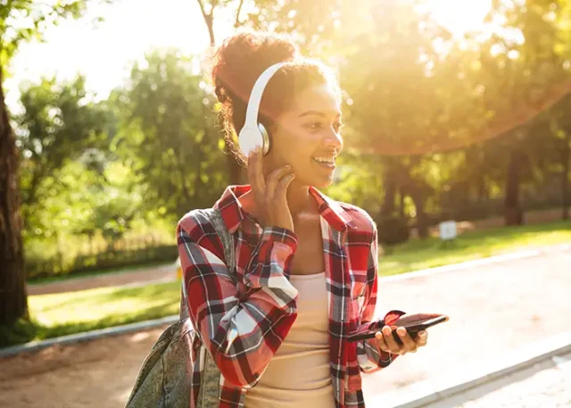 cheerful-young-african-woman-walking-outdoors copy