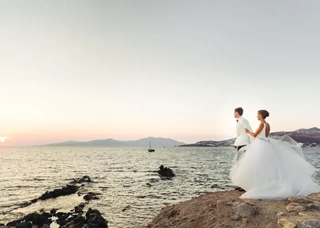 look-from-afar-lovely-wedding-couple-watching-sunset-sea copy