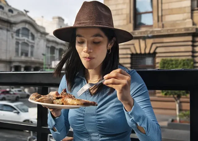 medium-shot-mexican-woman-eating-ranchero-food copy