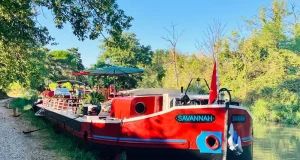 French Waterways Elevates Canal du Midi Voyage with Vintage Auto, Helicopter Tours