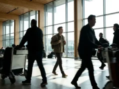 5 Small Habits for Smoother Travel Days People walking in an airport terminal with large windows.