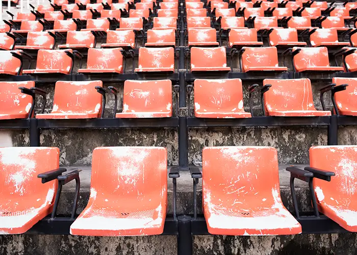 red-empty-old-plastic-seats-stadium copy