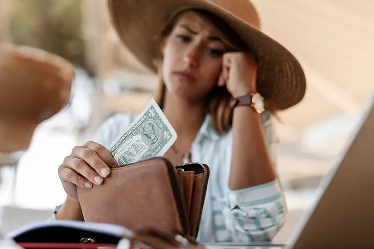 closeup-worried-woman-having-one-dollar-bill-her-wallet copy