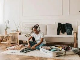a woman in the middle of packing for Dubai