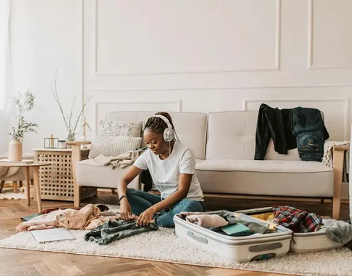 Packing for Dubai: What Health-Conscious Travelers Actually Need a woman in the middle of packing for Dubai