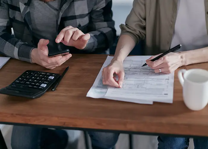 A Canadian family at home in the US reviewing financial paperwork