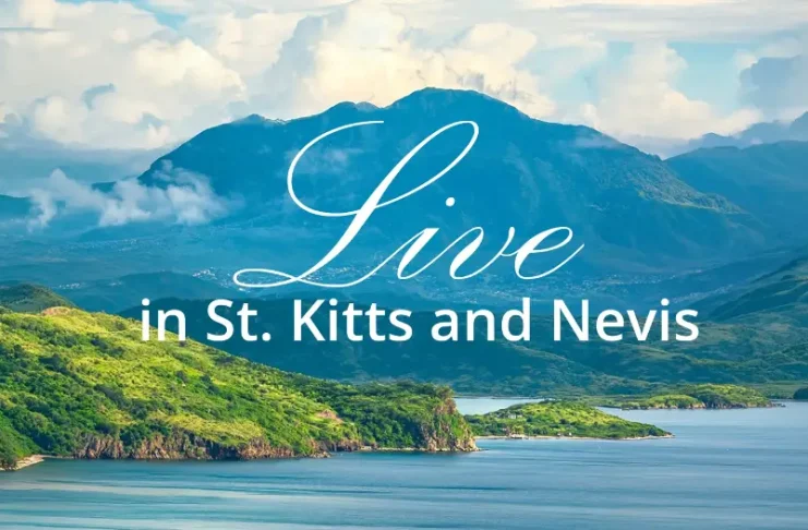 Scenic tropical coastline and mountains of St. Kitts and Nevis with the words “Live in St. Kitts and Nevis.”