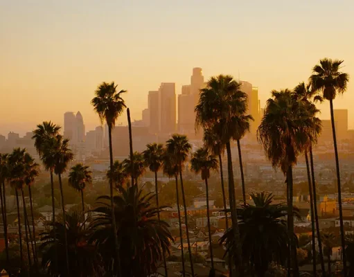 How to Spend a Day Exploring Los Angeles Before Hotel Check-In Los Angeles skyline at golden hour.