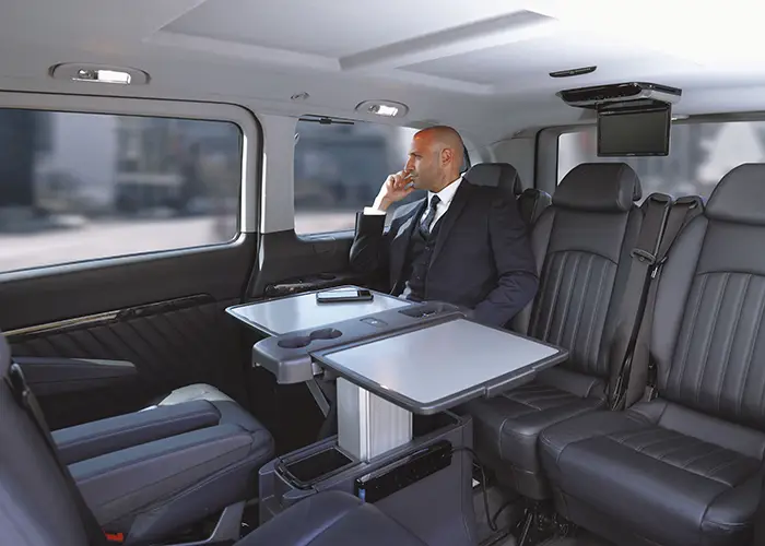man-in-suit-on-corporate-van-commute-2026-03-18-06-51-15-utc copy