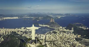 Cunard Reveals Bucket-List Shore Experiences for Its 2027 World Voyages Rio De Janeiro, Brazil : Aerial View Of Christ And Botafogo Bay From High Angle