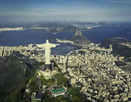 Cunard Reveals Bucket-List Shore Experiences for Its 2027 World Voyages Rio De Janeiro, Brazil : Aerial View Of Christ And Botafogo Bay From High Angle