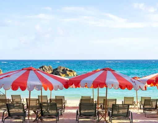 Bermuda in Fall 2026: New Beaches, Art, Food and World-Class Tennis Pink-sand beach and striped umbrellas at Palmetto Beach Club in Bermuda
