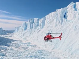 Scenic helicopter flight above Antarctica's snow-covered mountains and glaciers near Union Glacier.