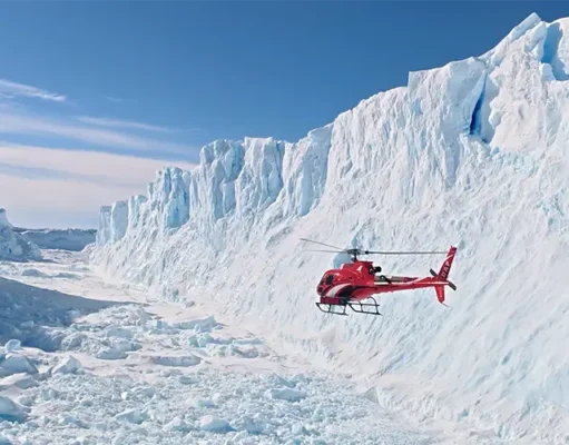 Antarctica From Above: New Helicopter Flights Offer a Spectacular Polar Adventure Scenic helicopter flight above Antarctica's snow-covered mountains and glaciers near Union Glacier.