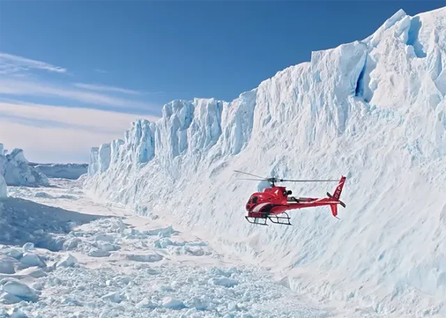 Helicopter Flight Through Antarctica copy Scenic helicopter flight above Antarctica's snow-covered mountains and glaciers near Union Glacier.