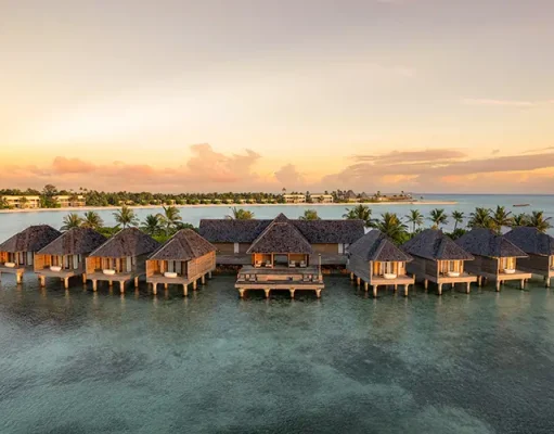 Kuda Villingili Resort Maldives Earns Place in the MICHELIN Guide Hotel Collection 2026 Aerial view of Kuda Villingili Resort Maldives, featuring luxury overwater villas and turquoise waters in North Malé Atoll.