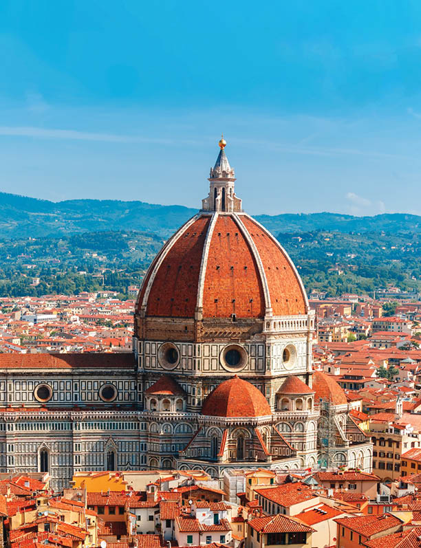 View of city rooftops and Duomo Santa Maria Del Fiore at morning from Palazzo Vecchio in Florence, Tuscany, Italy