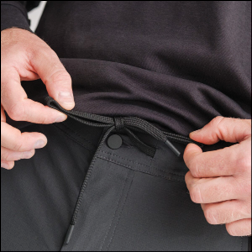A man is adjusting his belt. Description generated by AI