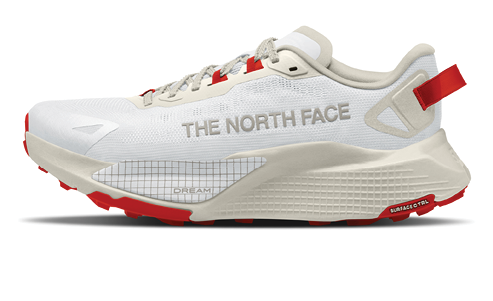 A white shoe with red laces and a red sole. Description generated by AI