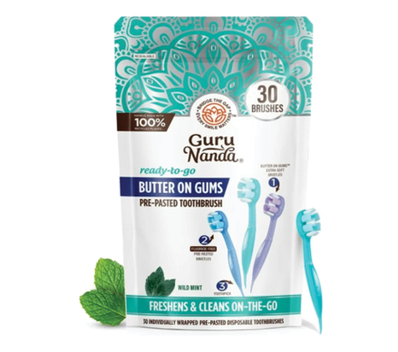 A bag of Guru Nanda toothbrushes with blue and purple bristles. Description generated by AI