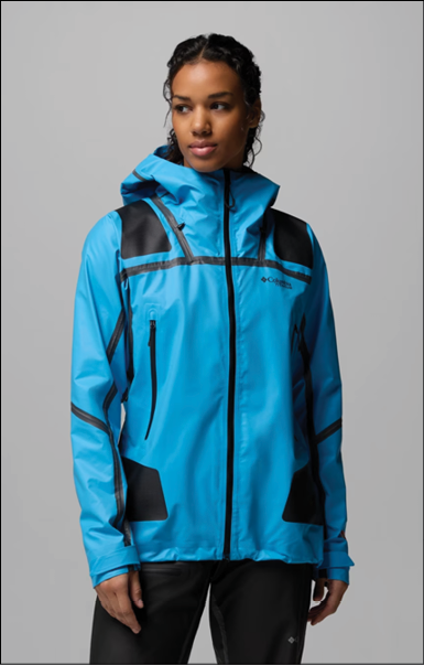 A woman wearing a blue jacket with a hood. Description generated by AI