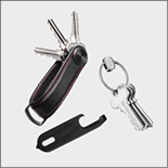 A keychain with keys and a key clip. Description generated by AI