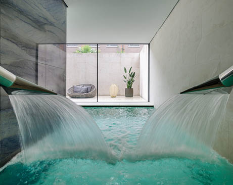 A shower with water pouring out of it. Description generated by AI