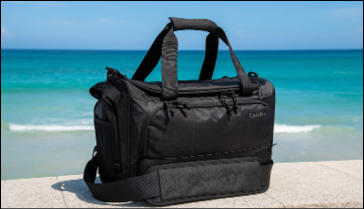 A black bag is sitting on a concrete ledge. Description generated by AI