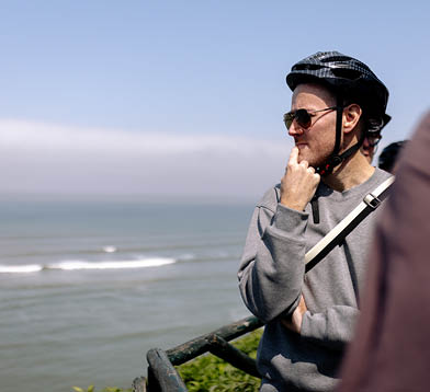 A man wearing a helmet and sunglasses. Description generated by AI