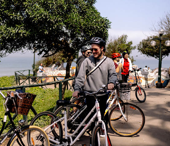 A man on a bicycle with a bag on the back. Description generated by AI