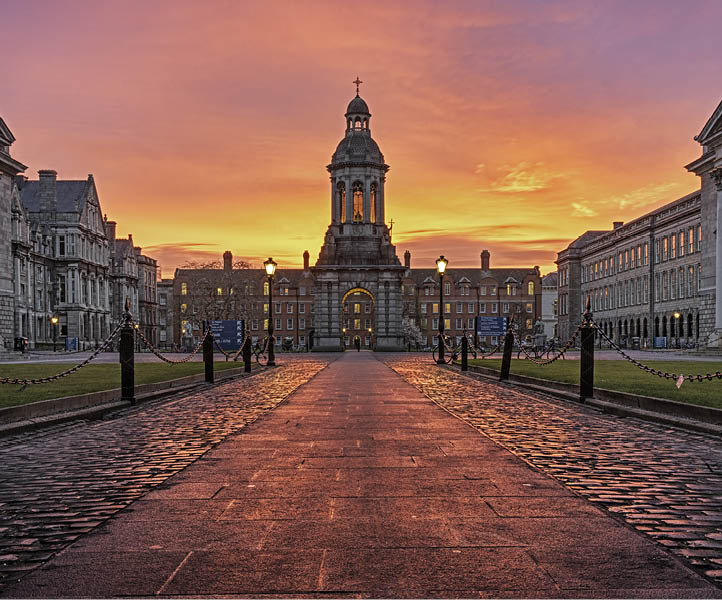A large building with a clock tower and a cross on top. Description generated by AI